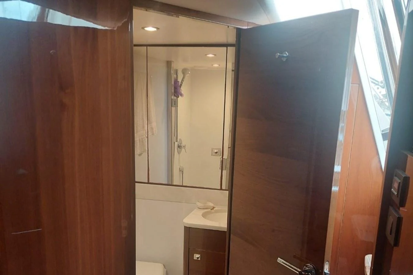 a bathroom with a mirror aboard DANI Yacht for Sale