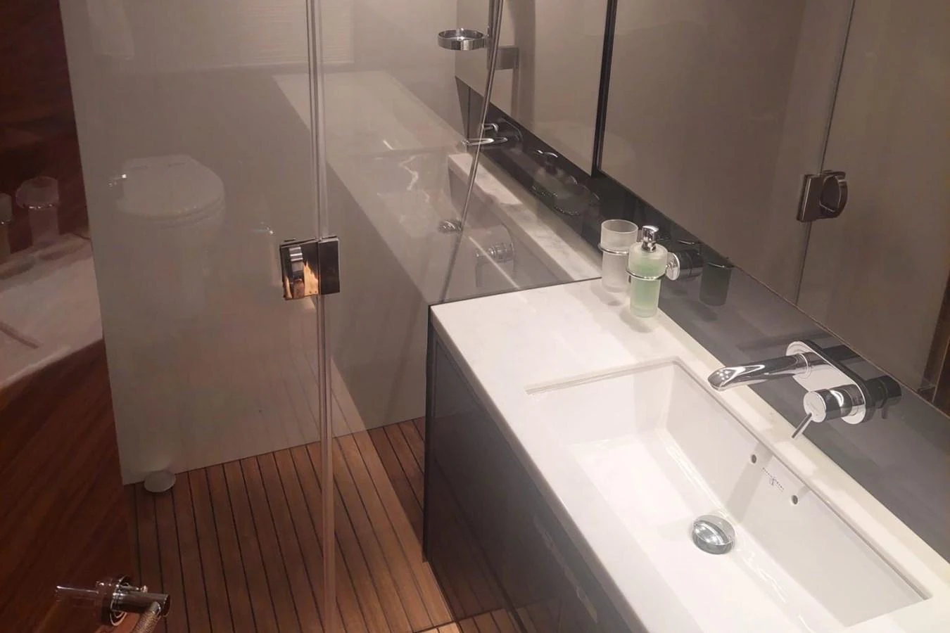 a bathroom with a shower and sink aboard DANI Yacht for Sale
