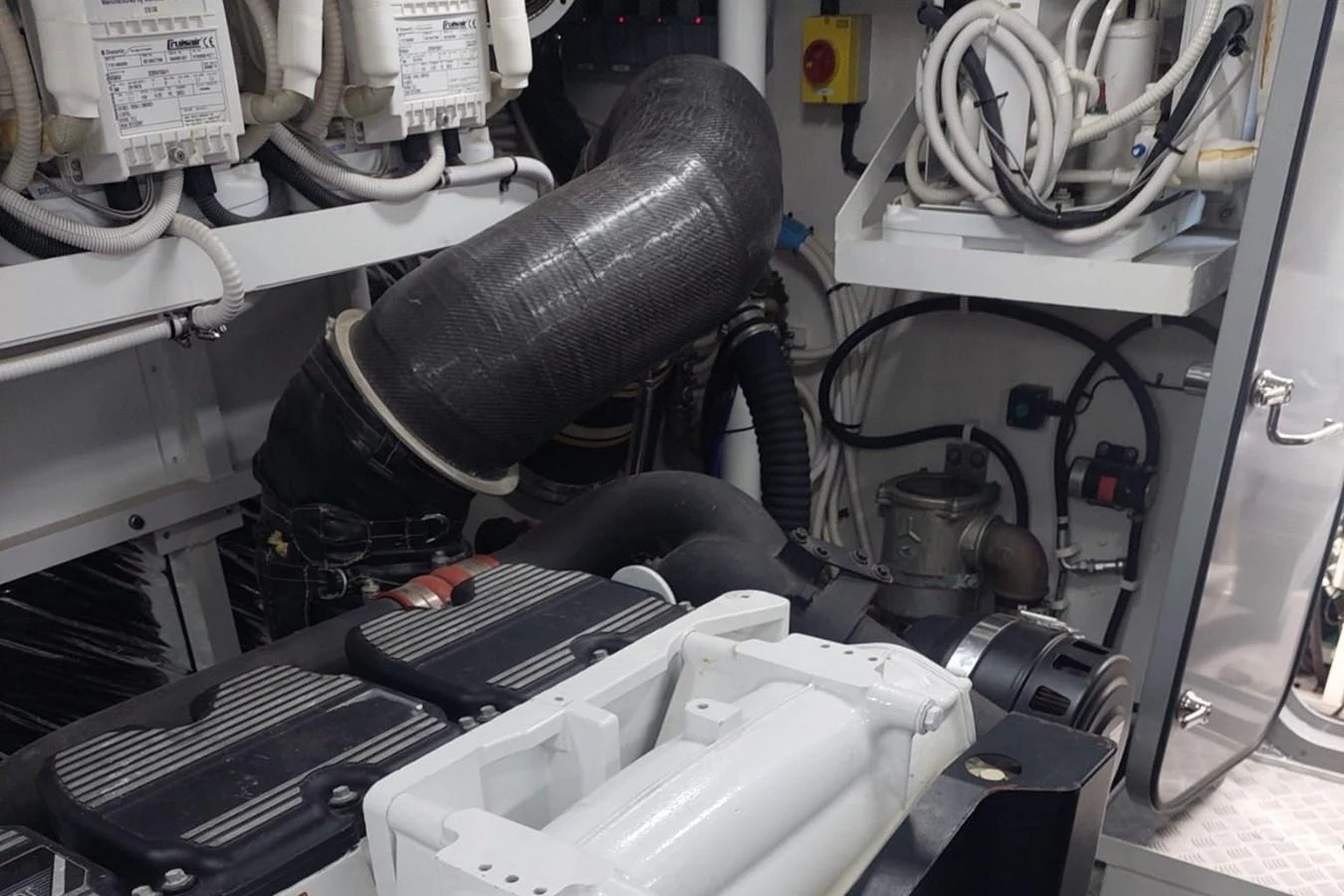 a car engine with a black hood aboard DANI Yacht for Sale
