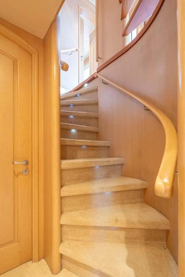 a staircase with a light on the side aboard CHANSON Yacht for Sale