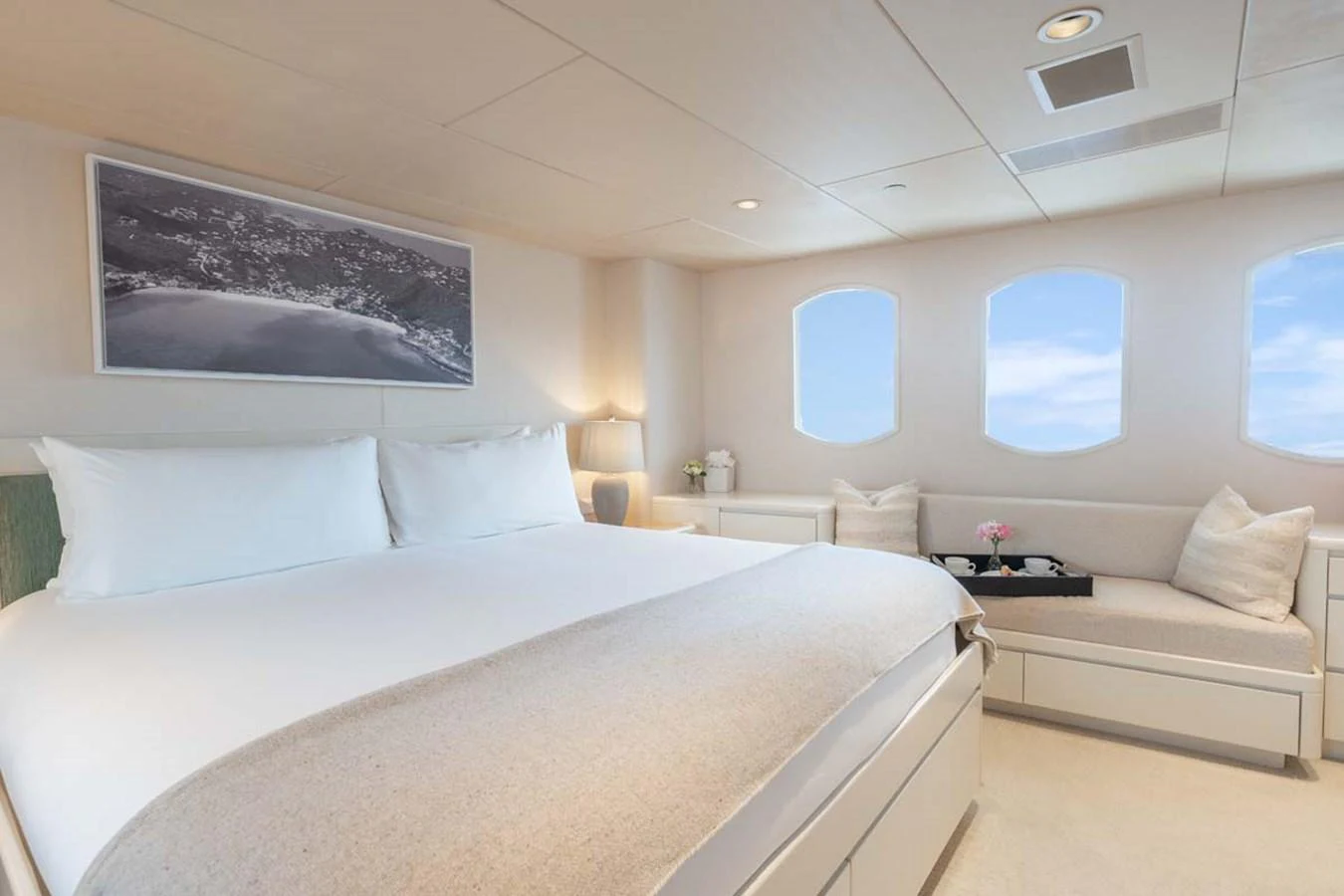 a room with a bed and a couch aboard CHANSON Yacht for Sale