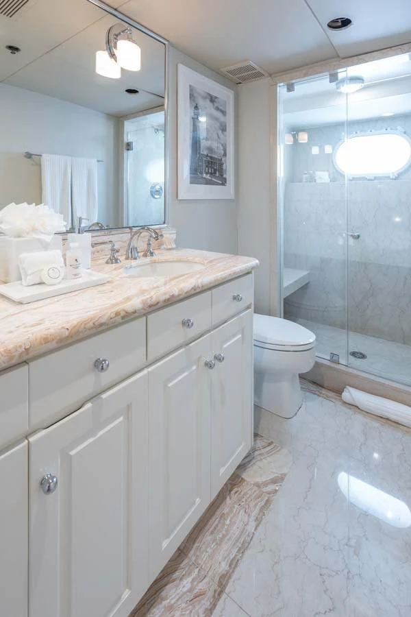 a bathroom with a sink and a shower aboard CHANSON Yacht for Sale
