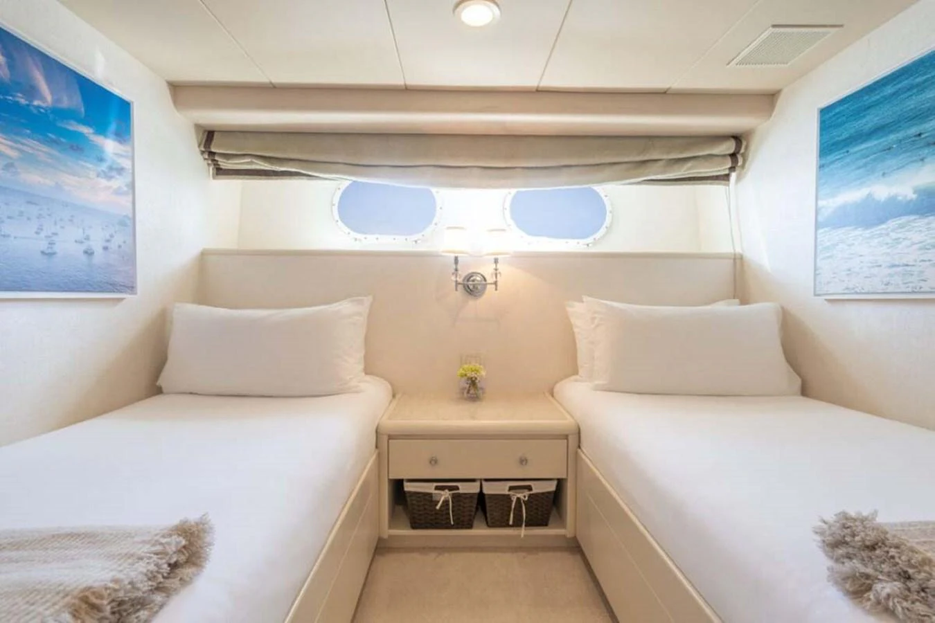 a room with white couches aboard CHANSON Yacht for Sale