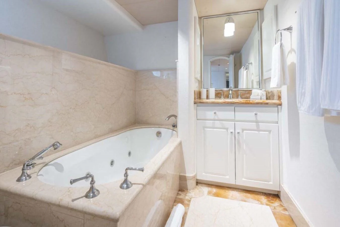 a bathroom with a bathtub and sink aboard CHANSON Yacht for Sale