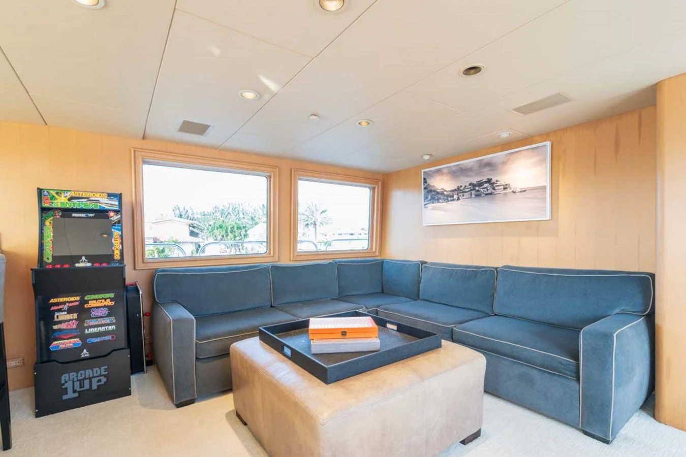 a living room with a blue couch aboard CHANSON Yacht for Sale