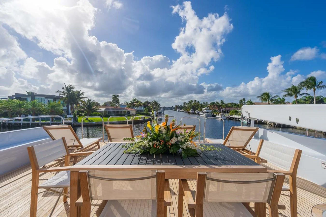 a table with chairs around it aboard CHANSON Yacht for Sale