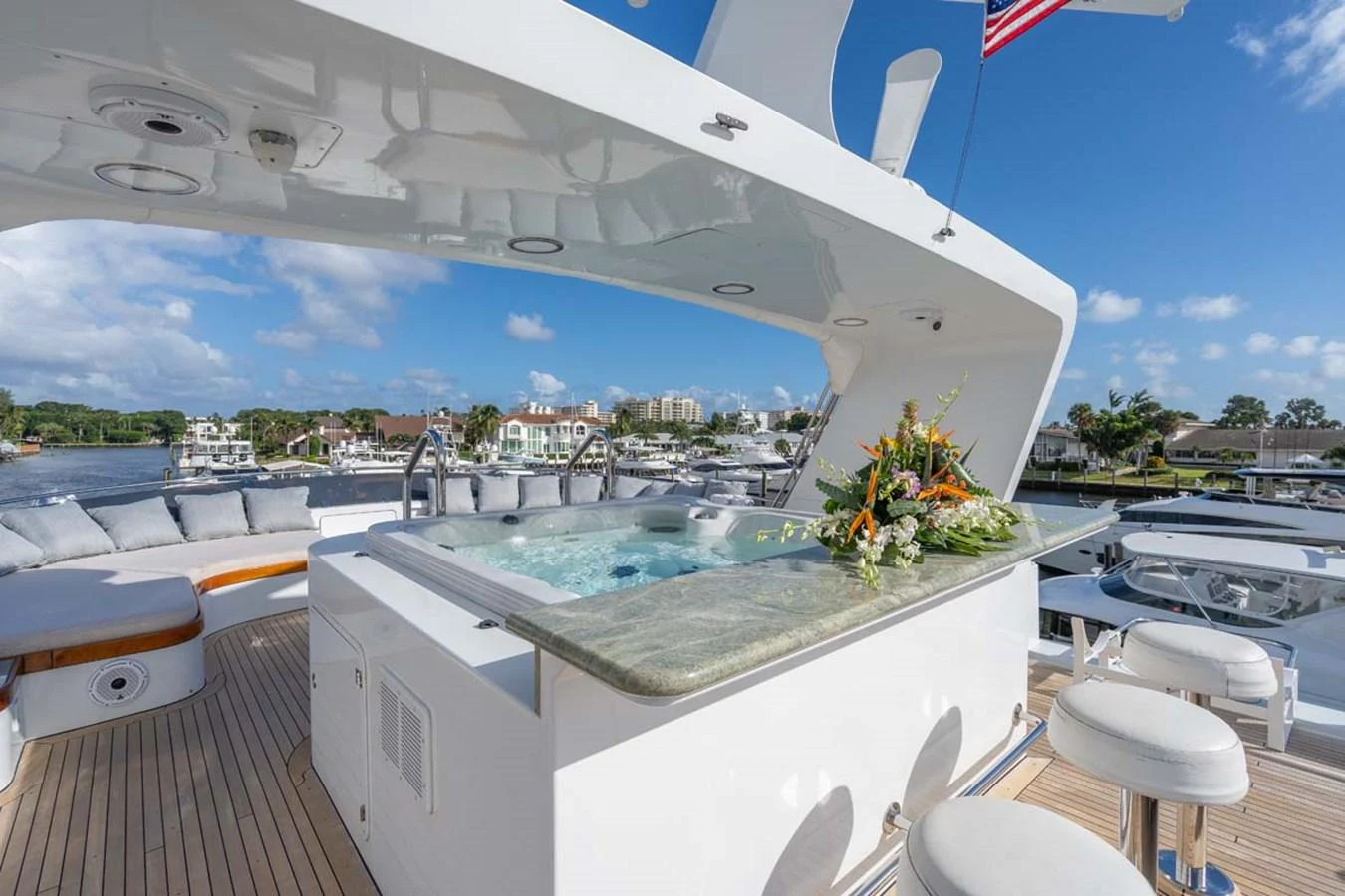 a large white building with a pool aboard CHANSON Yacht for Sale
