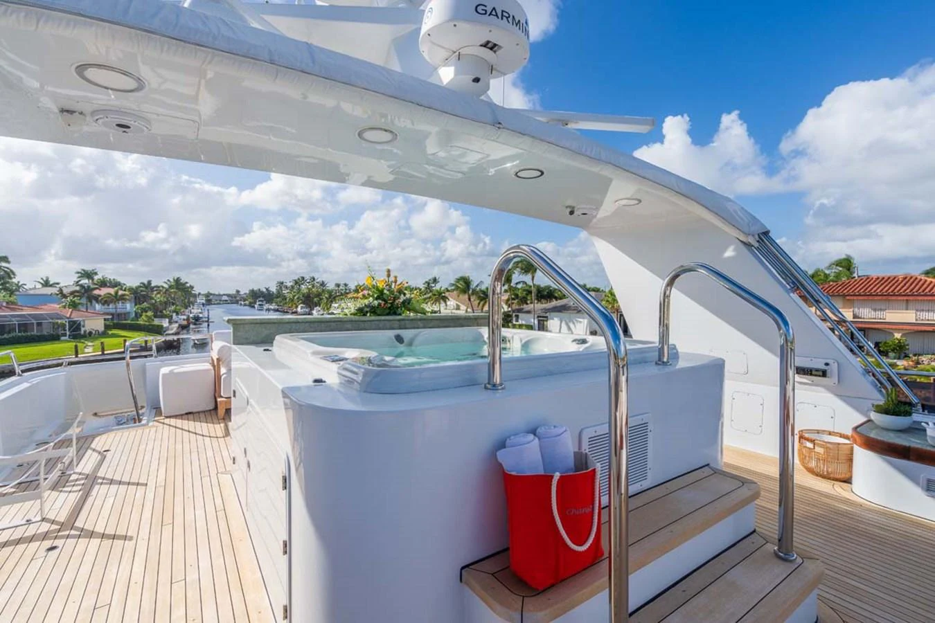 a deck with a pool and a deck with a view of the water aboard CHANSON Yacht for Sale