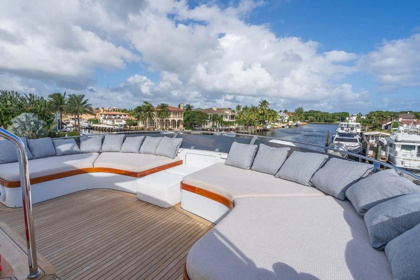 a deck with a view of a city and water aboard CHANSON Yacht for Sale