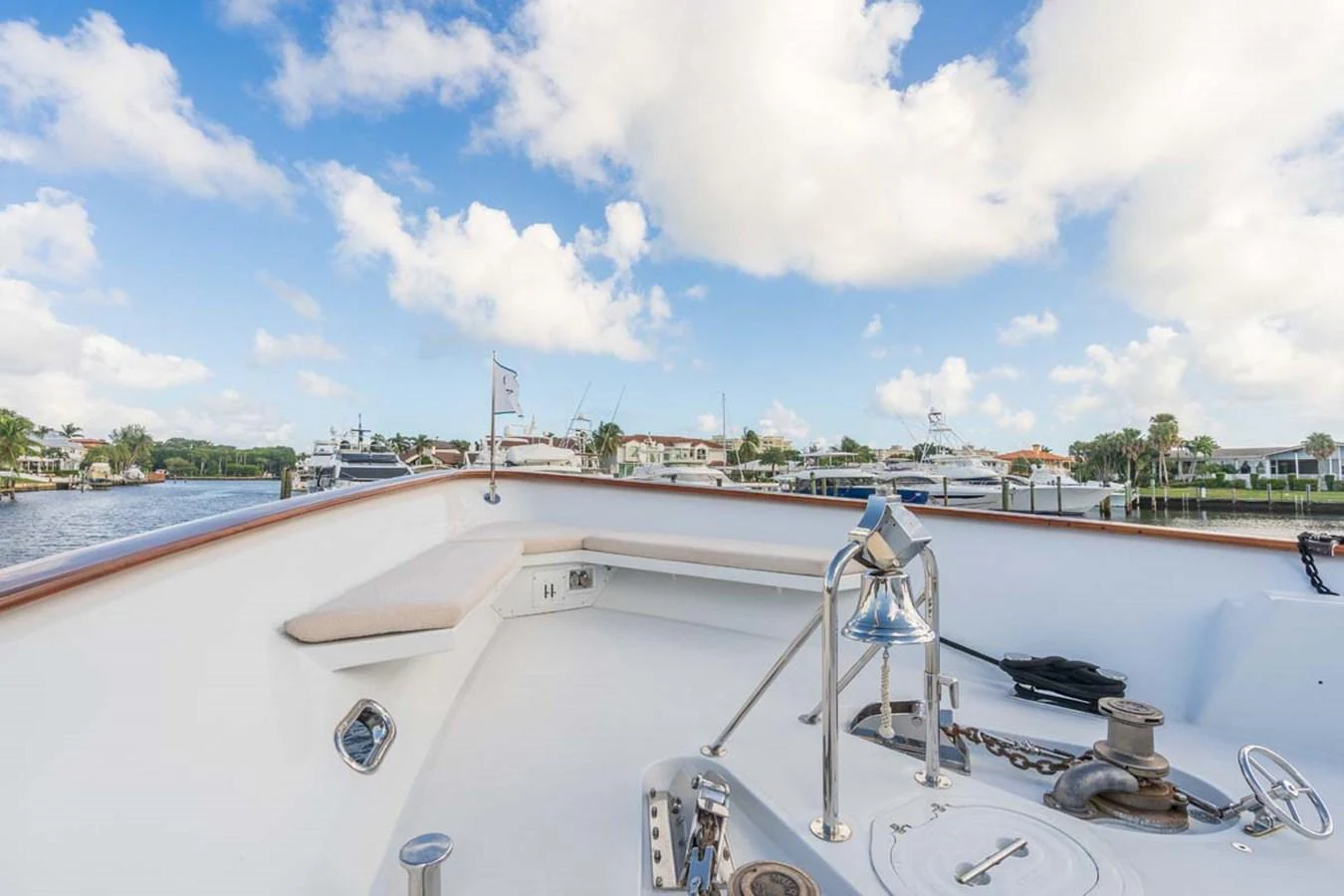 a boat with a view of a city in the background aboard CHANSON Yacht for Sale