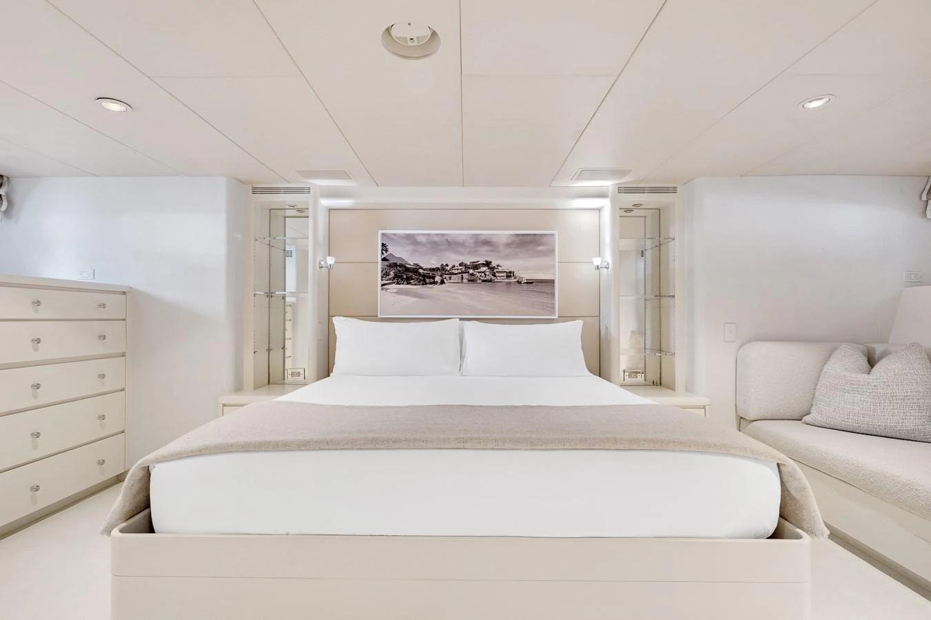 a white bedroom with a bed aboard CHANSON Yacht for Sale