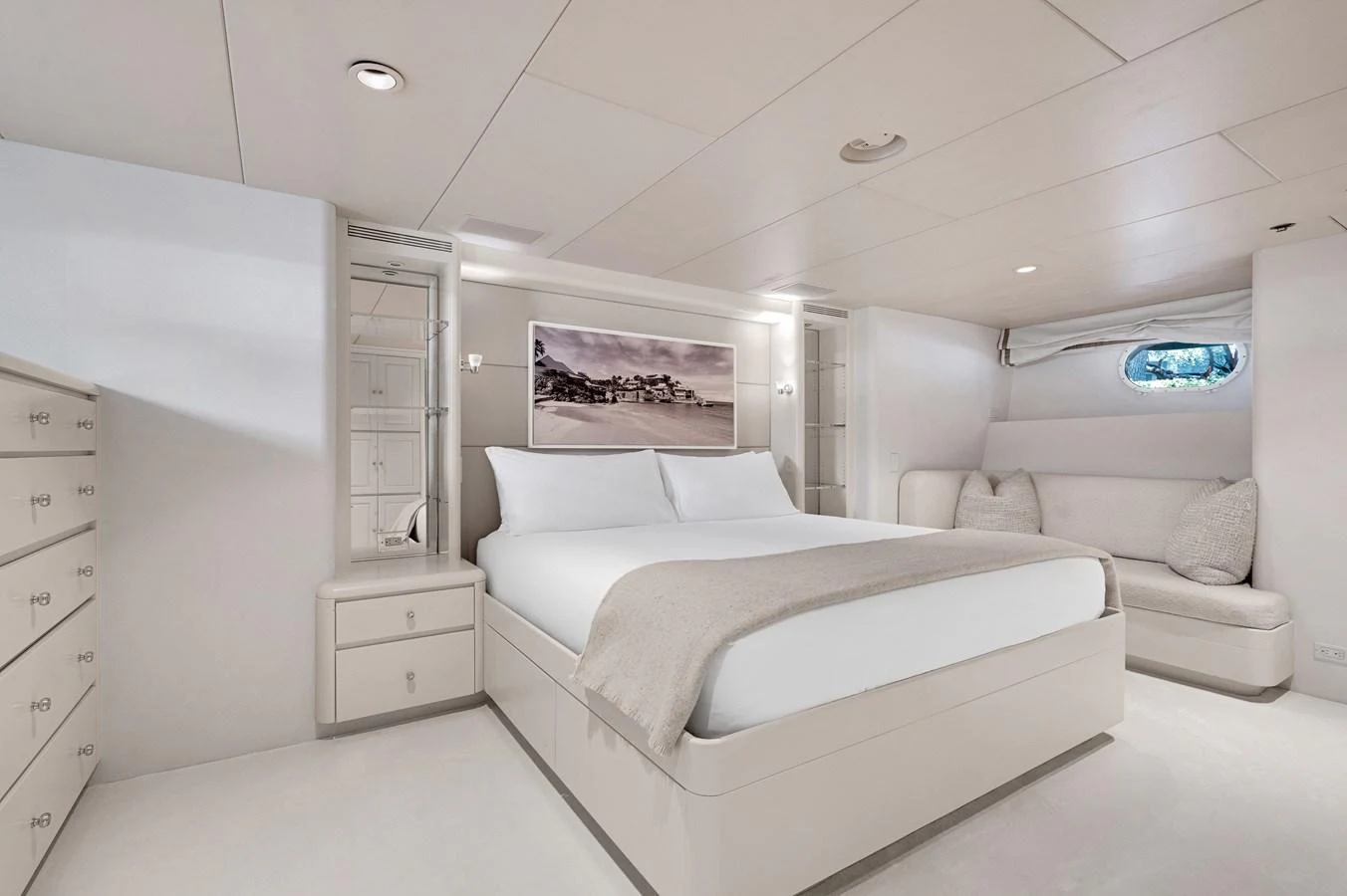 a white bedroom with a bed aboard CHANSON Yacht for Sale