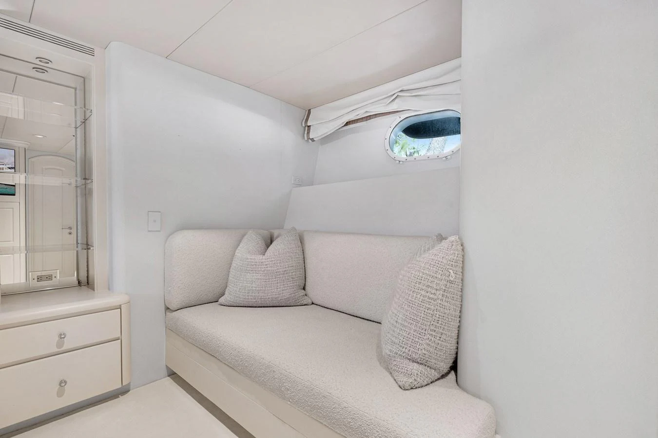 a white couch in a room aboard CHANSON Yacht for Sale