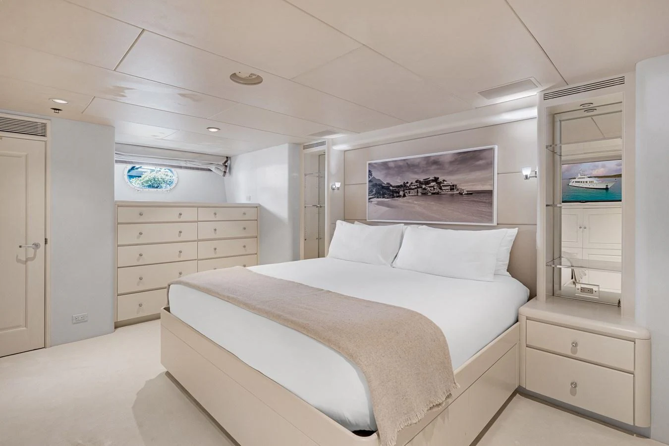 a white bedroom with a bed aboard CHANSON Yacht for Sale