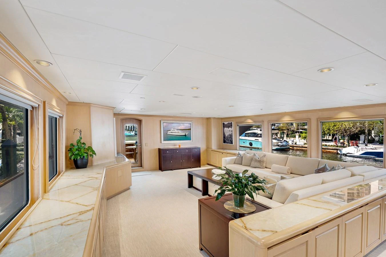 a large living room with a large window aboard CHANSON Yacht for Sale