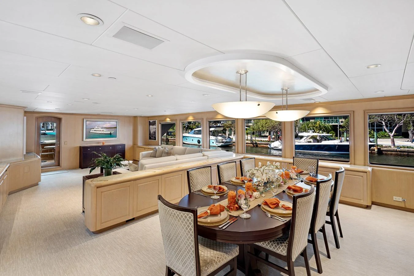 a large kitchen with a dining table aboard CHANSON Yacht for Sale