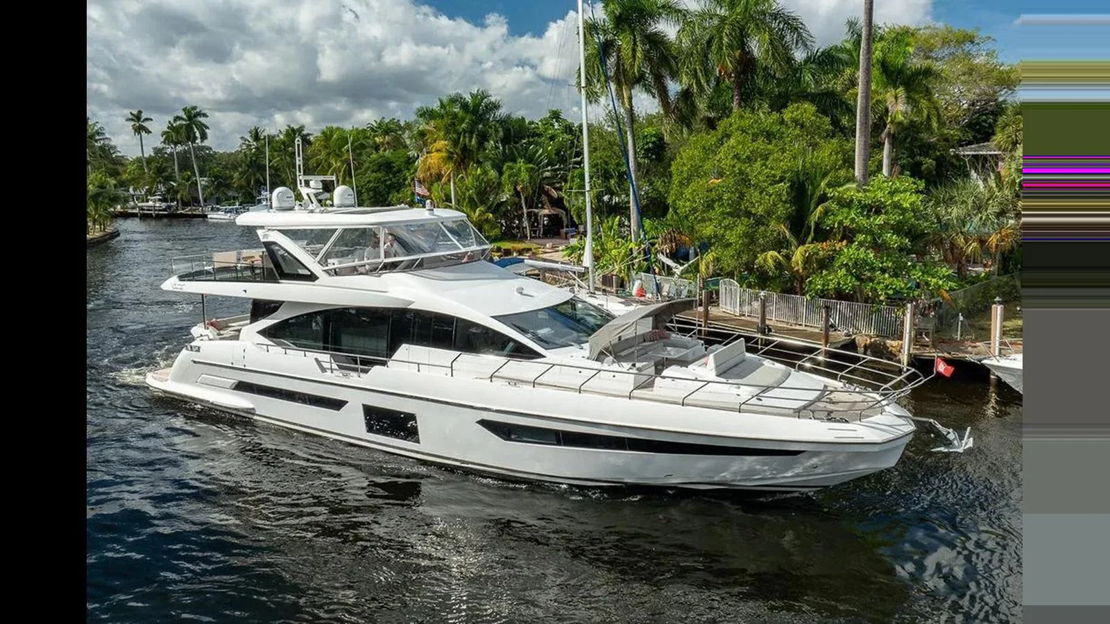 A sleek and modern yacht cruises along a lush, tropical waterway. aboard 2022 AZIMUT GRANDE 25 METRI Yacht for Sale