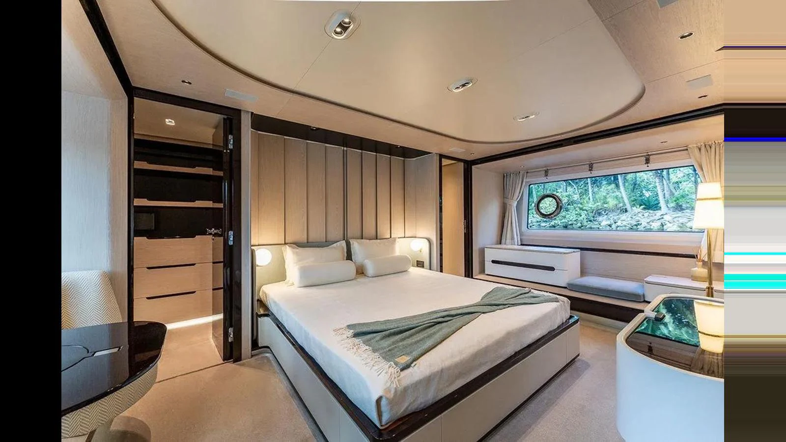 The master stateroom features a spacious bed, elegant furnishings, and a large window offering scenic views. aboard 2022 AZIMUT GRANDE 25 METRI Yacht for Sale