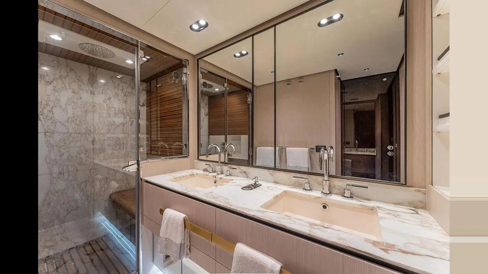 The yacht's bathroom features a luxurious double sink vanity and a spacious glass-enclosed shower. aboard 2022 AZIMUT GRANDE 25 METRI Yacht for Sale