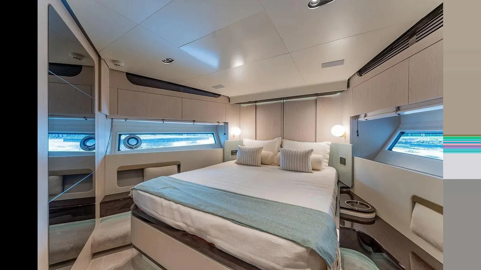 A luxurious stateroom featuring a comfortable bed with elegant bedding and ample natural light from large windows. aboard 2022 AZIMUT GRANDE 25 METRI Yacht for Sale