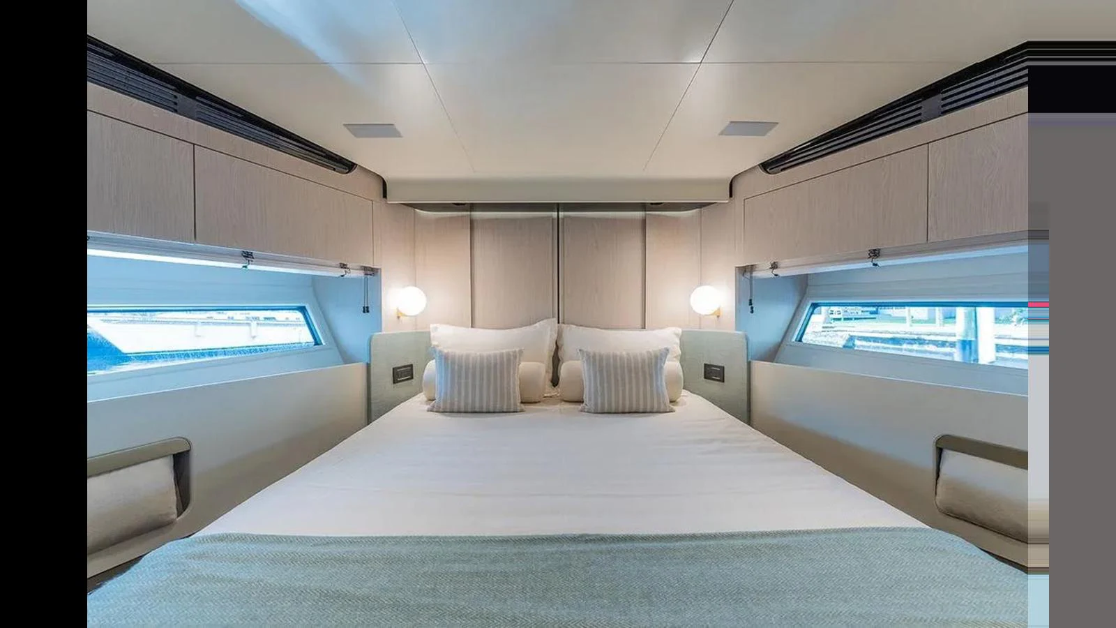 The stateroom features a luxurious bed with elegant lighting and ample storage. aboard 2022 AZIMUT GRANDE 25 METRI Yacht for Sale