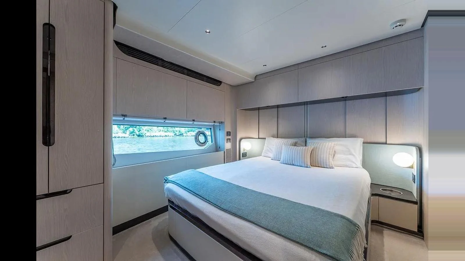 This image showcases a luxurious stateroom with a large bed and modern furnishings. aboard 2022 AZIMUT GRANDE 25 METRI Yacht for Sale