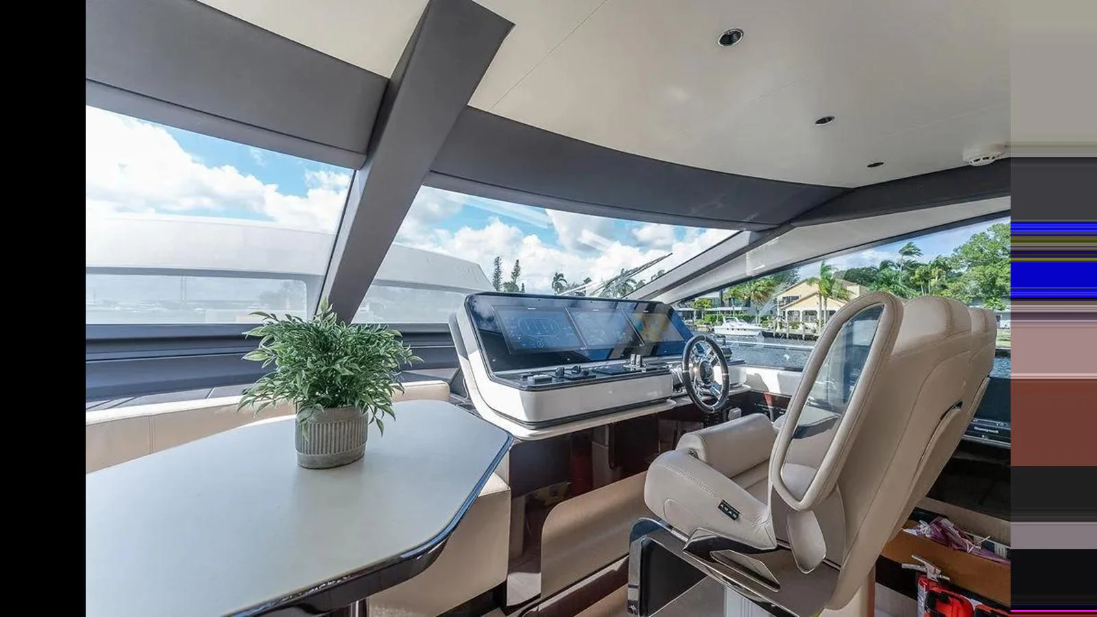 The helm area features a sleek design with panoramic windows and a comfortable captain's chair. aboard 2022 AZIMUT GRANDE 25 METRI Yacht for Sale