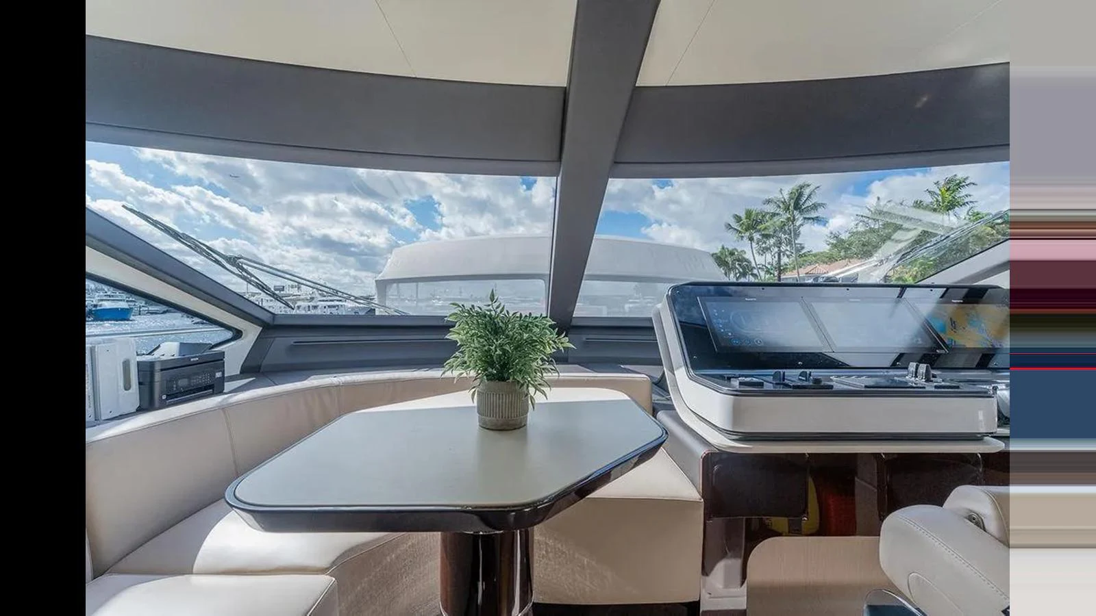 The helm area features a sleek design with a comfortable seating arrangement and panoramic windows offering stunning views. aboard 2022 AZIMUT GRANDE 25 METRI Yacht for Sale