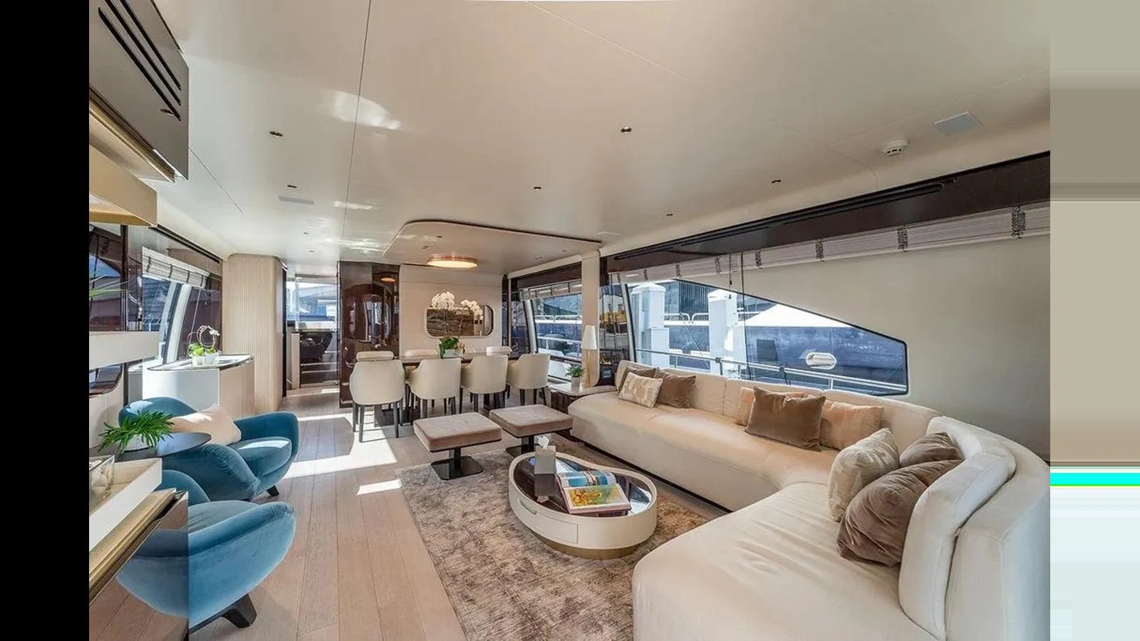 The yacht's salon features a spacious and elegantly designed living area with ample seating and large windows for natural light. aboard 2022 AZIMUT GRANDE 25 METRI Yacht for Sale