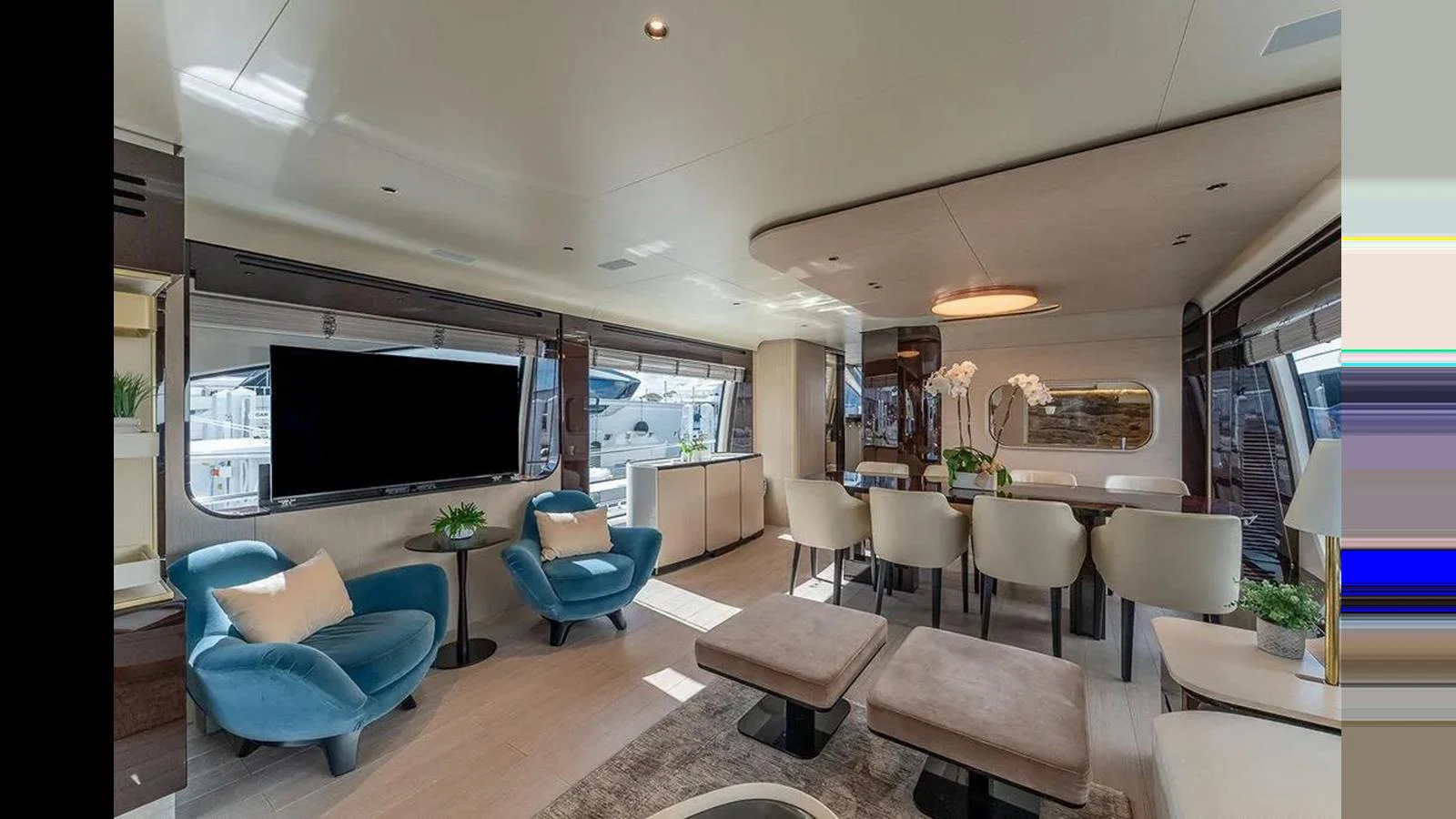 The salon features a spacious and elegant seating area with modern furnishings and large windows offering ample natural light. aboard 2022 AZIMUT GRANDE 25 METRI Yacht for Sale