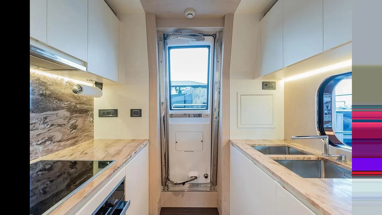 The yacht's galley features modern appliances and ample counter space, creating a functional and stylish cooking area. aboard 2022 AZIMUT GRANDE 25 METRI Yacht for Sale