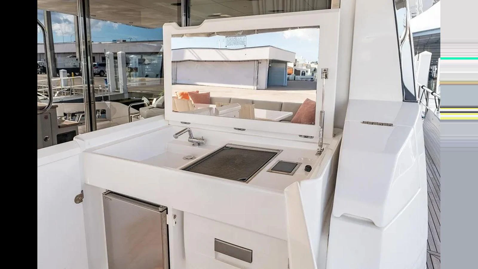 The yacht features a sleek outdoor galley with modern appliances and ample counter space. aboard 2022 AZIMUT GRANDE 25 METRI Yacht for Sale