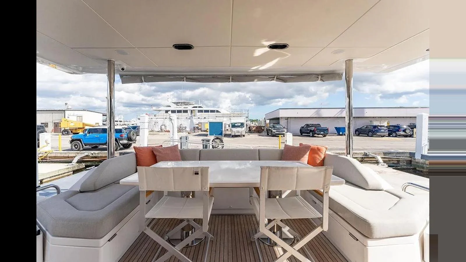 The aft deck features a comfortable seating area with a table, perfect for outdoor dining and relaxation. aboard 2022 AZIMUT GRANDE 25 METRI Yacht for Sale