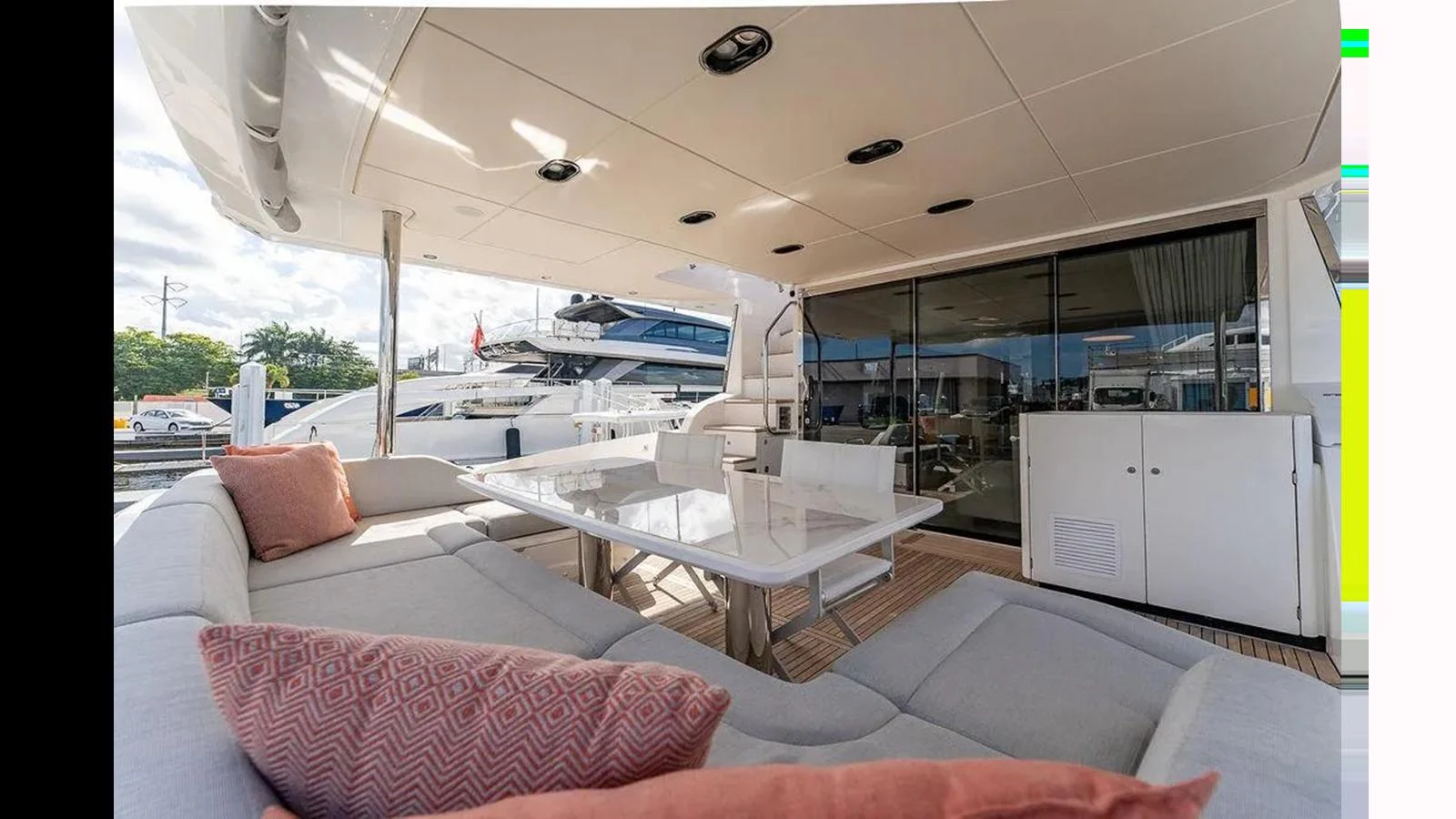 The aft deck features a spacious seating area with a dining table, perfect for alfresco meals and relaxation. aboard 2022 AZIMUT GRANDE 25 METRI Yacht for Sale