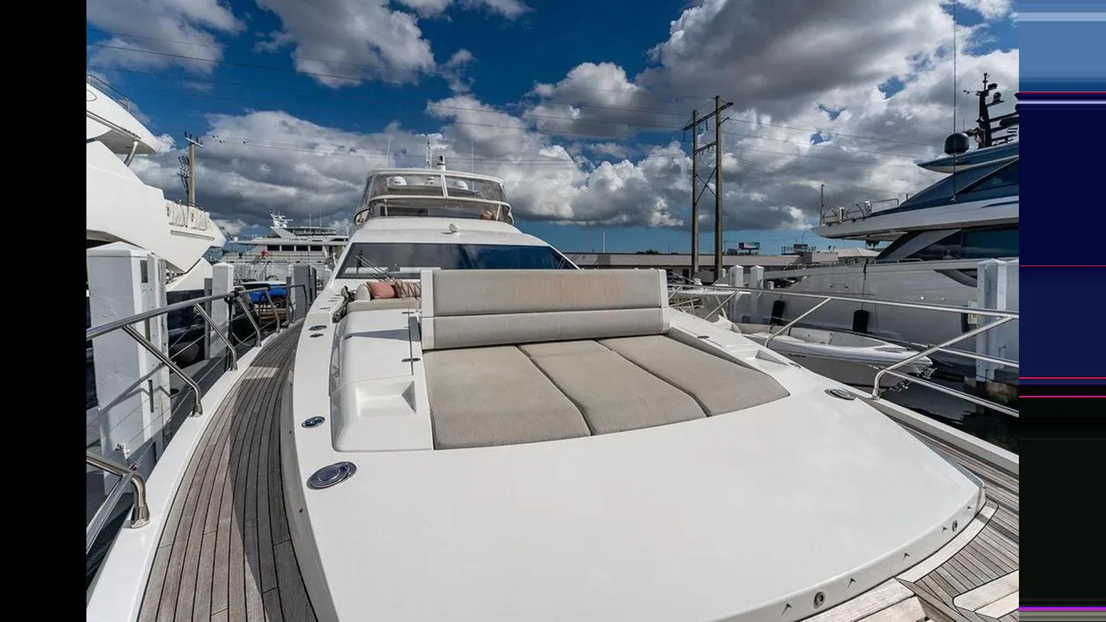 The yacht's foredeck features a spacious sunbathing area with plush cushions, perfect for relaxation under the open sky. aboard 2022 AZIMUT GRANDE 25 METRI Yacht for Sale