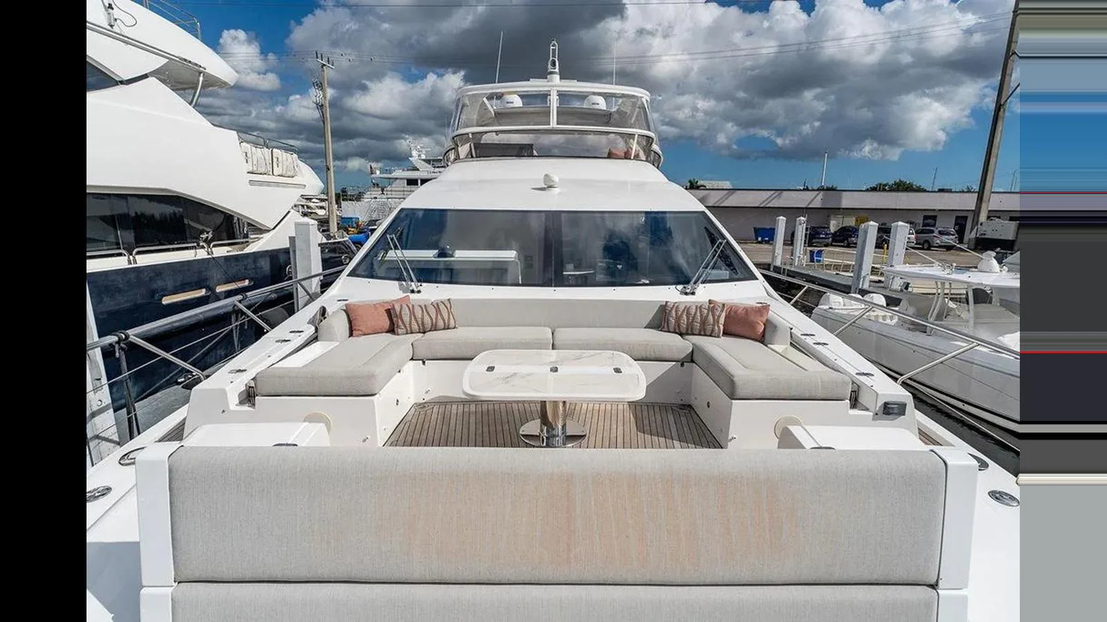The yacht's aft deck features a spacious seating area with a central table, perfect for outdoor relaxation. aboard 2022 AZIMUT GRANDE 25 METRI Yacht for Sale