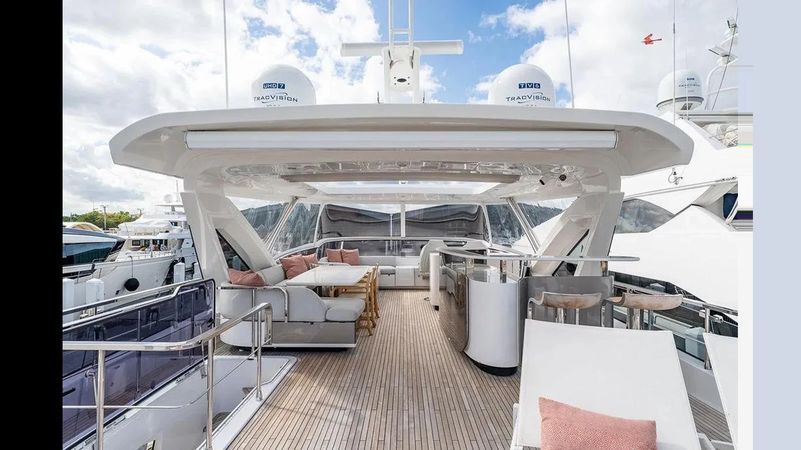 The yacht's flybridge offers a spacious and luxurious outdoor seating area with modern amenities. aboard 2022 AZIMUT GRANDE 25 METRI Yacht for Sale