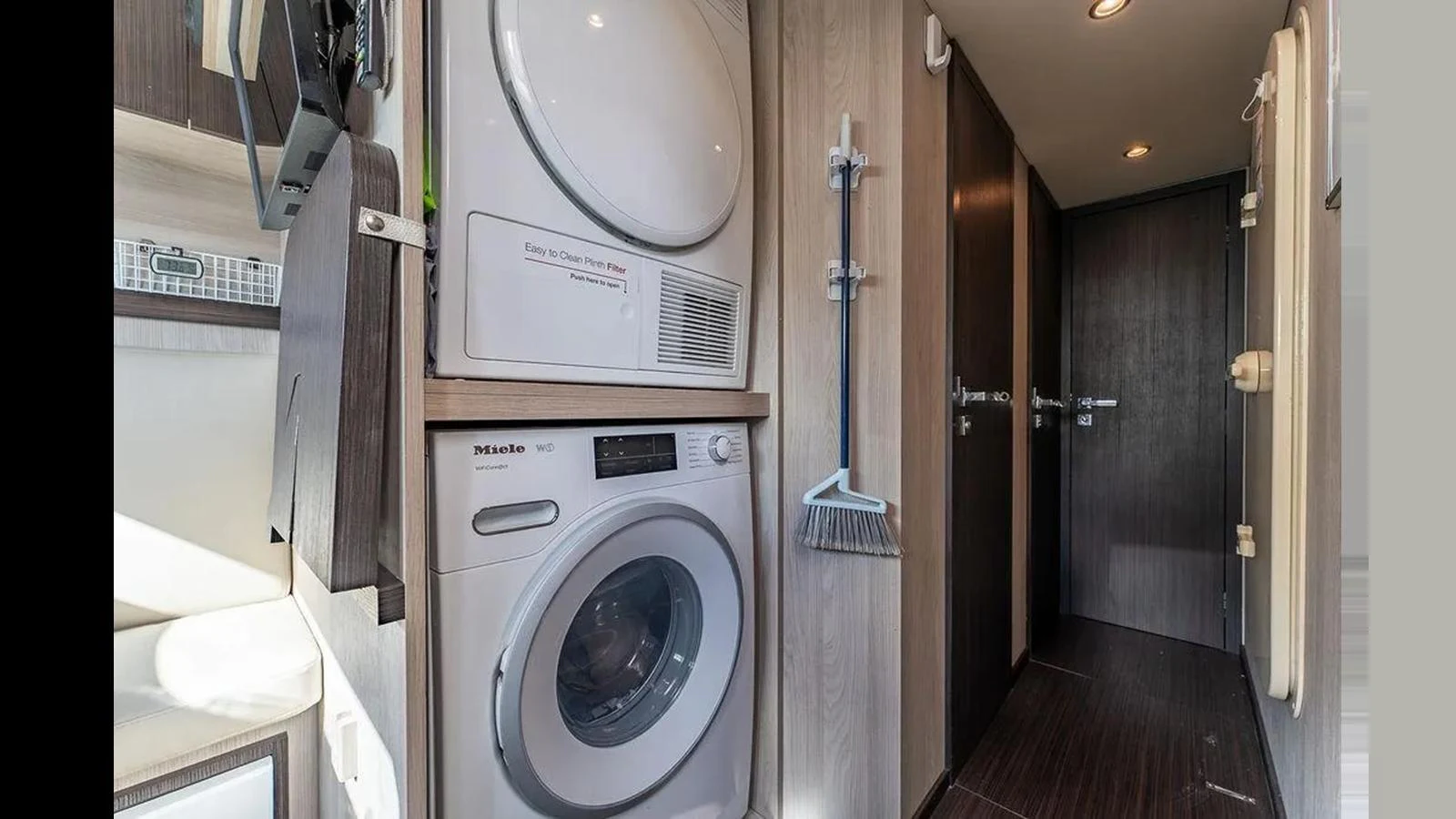 The yacht features a well-equipped laundry area with modern appliances. aboard 2022 AZIMUT GRANDE 25 METRI Yacht for Sale