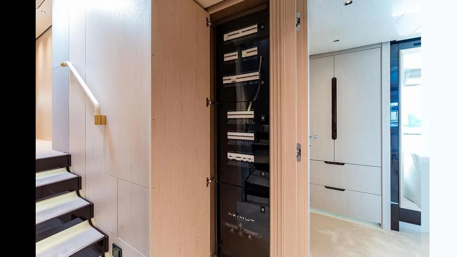 This image showcases a technical area within the yacht, featuring a server or control panel. aboard 2022 AZIMUT GRANDE 25 METRI Yacht for Sale
