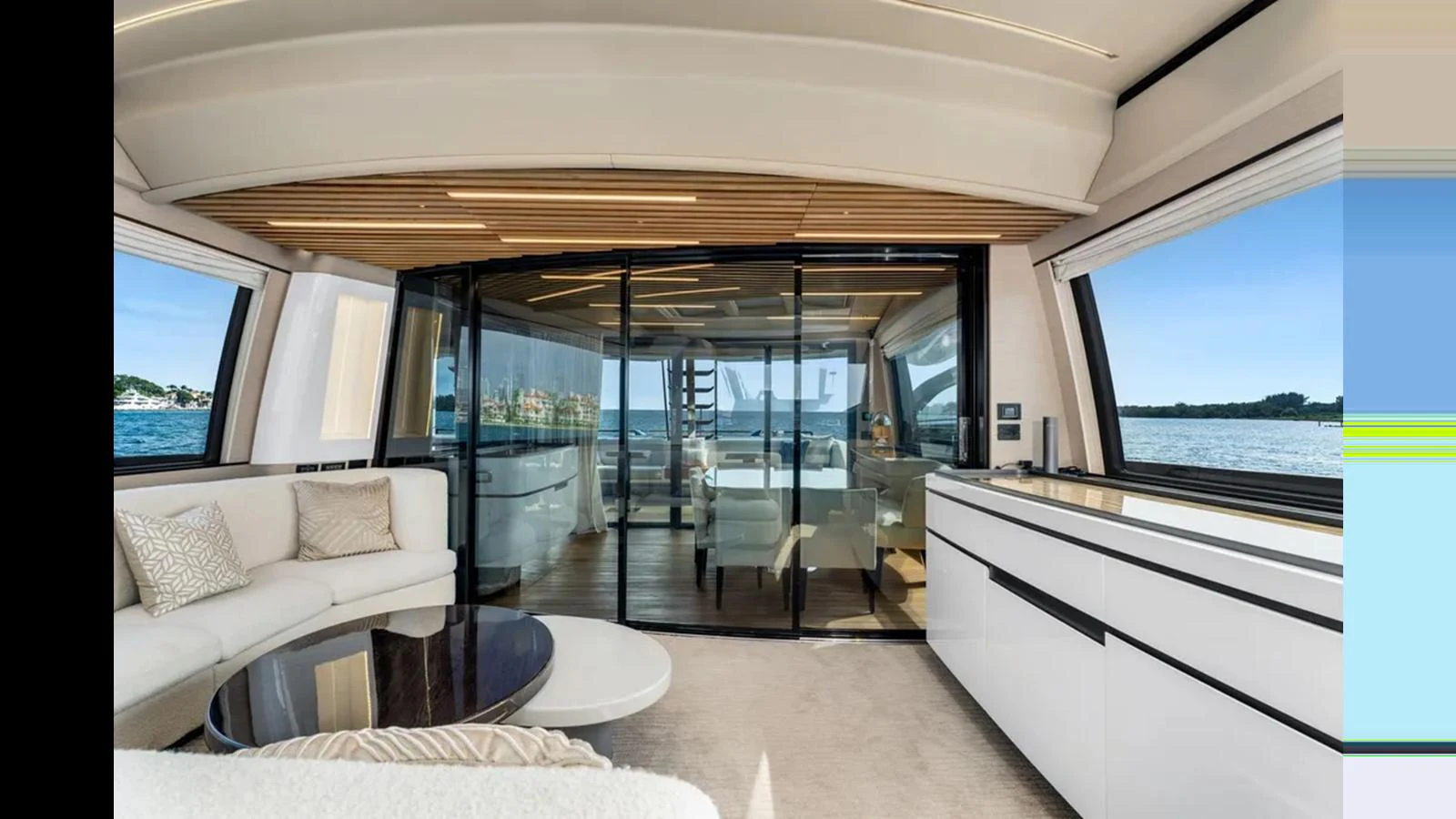The yacht's salon features a spacious and modern design with large windows offering stunning views. aboard 2022 AZIMUT S10 Yacht for Sale