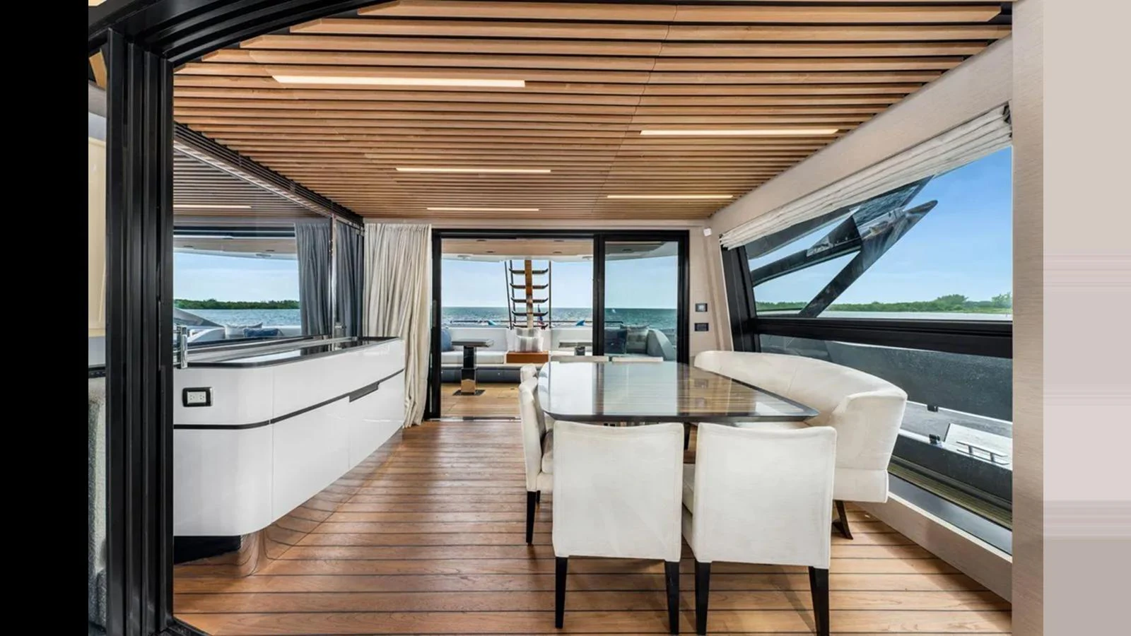 The yacht's dining area features a sleek, modern design with ample natural light and elegant furnishings. aboard 2022 AZIMUT S10 Yacht for Sale