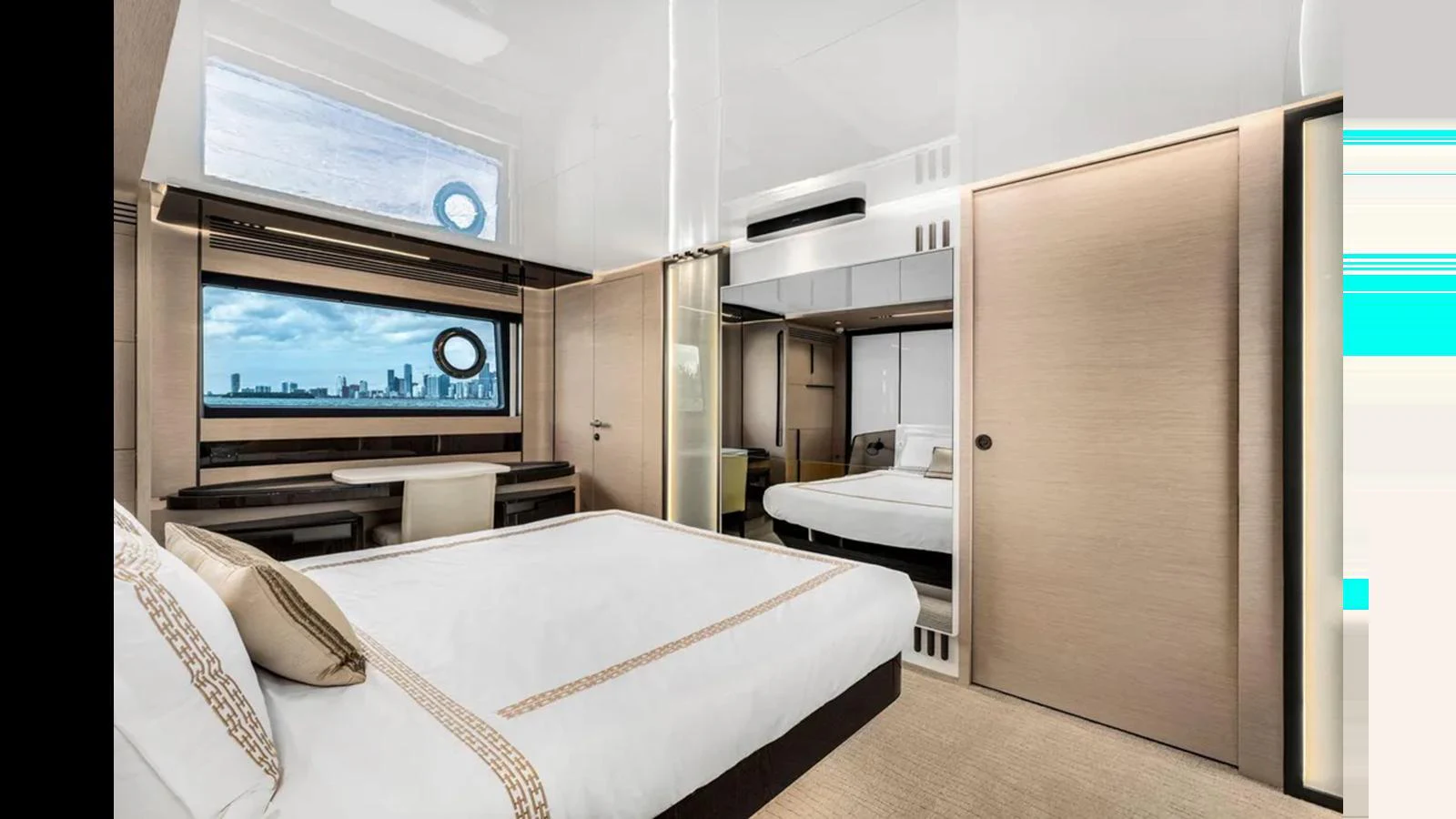 The stateroom features a luxurious bed, ample storage, and large windows with a stunning view. aboard 2022 AZIMUT S10 Yacht for Sale