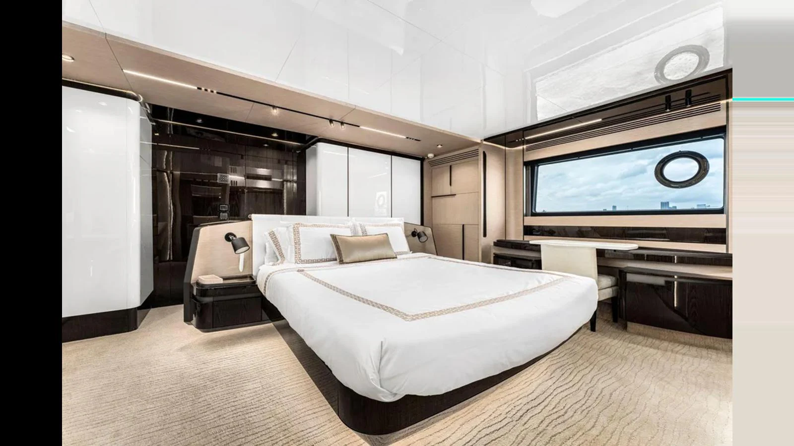 The master stateroom features a luxurious bed, elegant furnishings, and a large window offering stunning views. aboard 2022 AZIMUT S10 Yacht for Sale