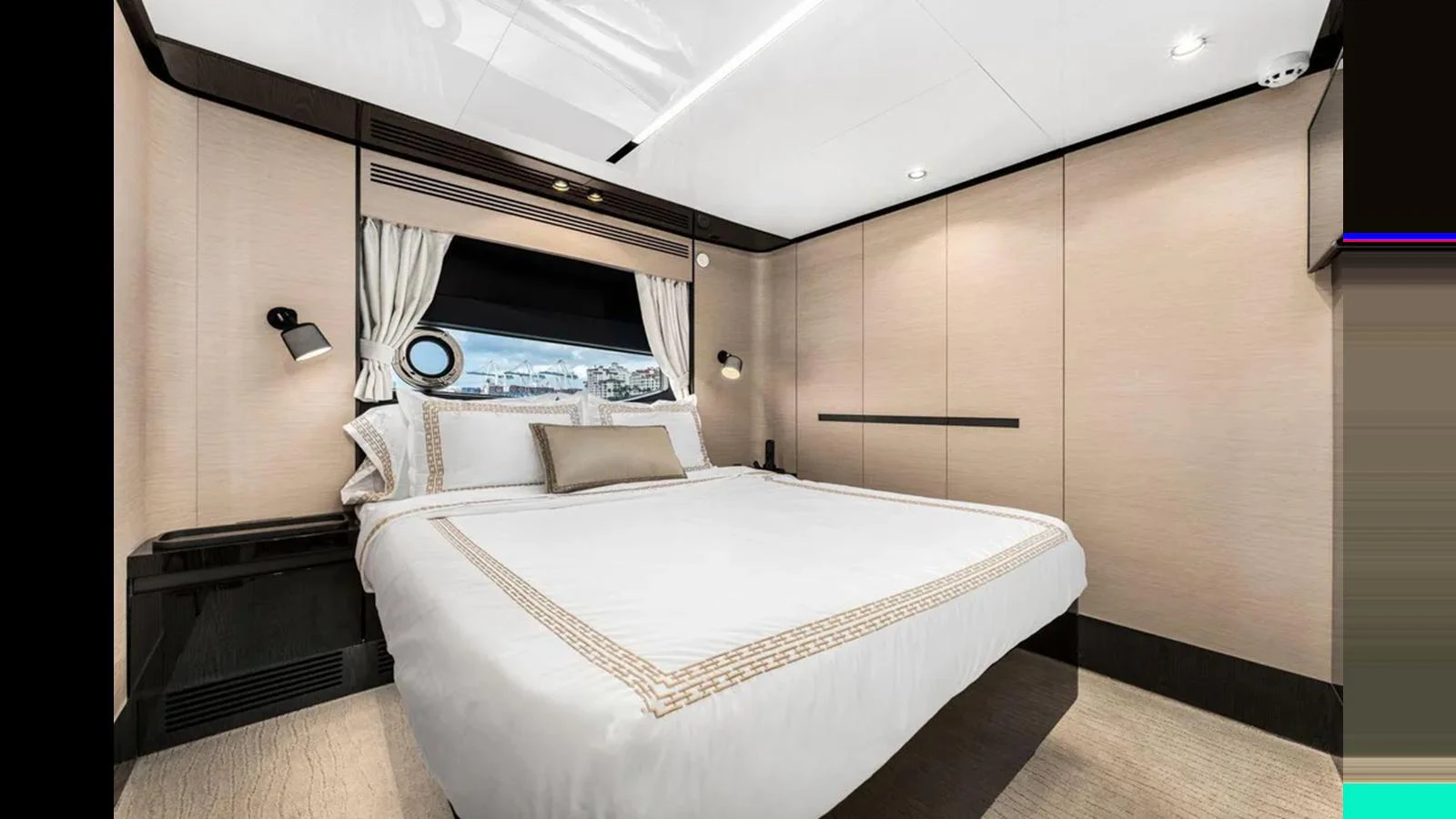 A luxurious stateroom featuring a large bed with elegant bedding and modern lighting. aboard 2022 AZIMUT S10 Yacht for Sale