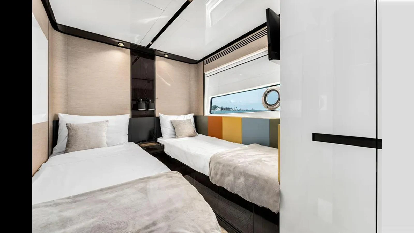 A modern guest stateroom featuring twin beds and a large window offering a scenic view. aboard 2022 AZIMUT S10 Yacht for Sale