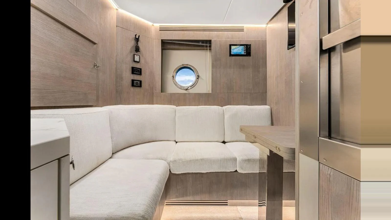 A cozy salon area with comfortable seating and modern decor. aboard 2022 AZIMUT S10 Yacht for Sale