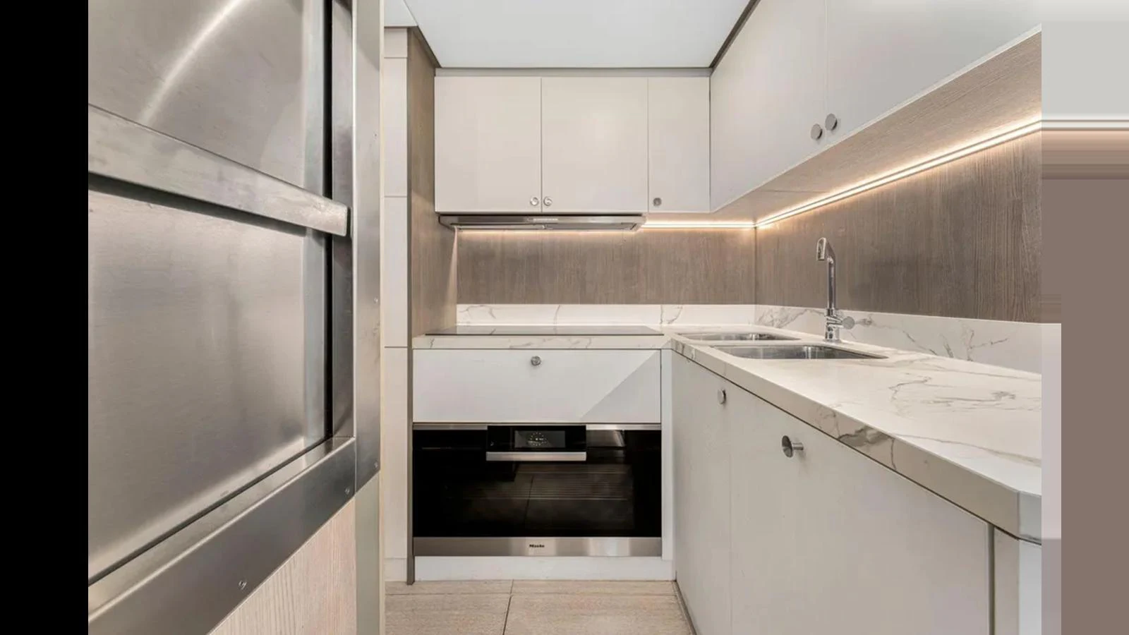 The yacht's galley features modern appliances and sleek cabinetry, creating a functional and stylish cooking space. aboard 2022 AZIMUT S10 Yacht for Sale