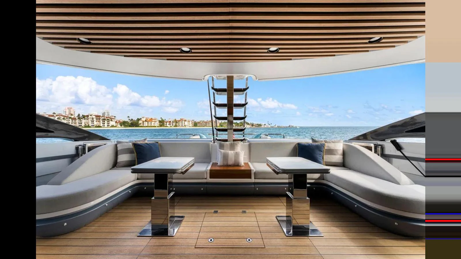 The aft deck features a spacious seating area with modern tables and a stunning view of the water. aboard 2022 AZIMUT S10 Yacht for Sale