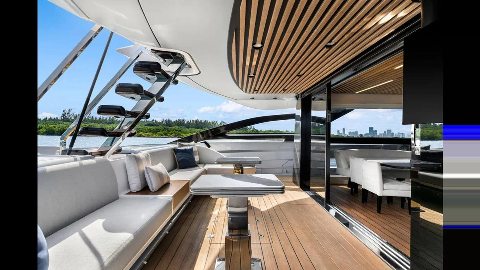 The aft deck features elegant seating and dining areas with a view of the water. aboard 2022 AZIMUT S10 Yacht for Sale