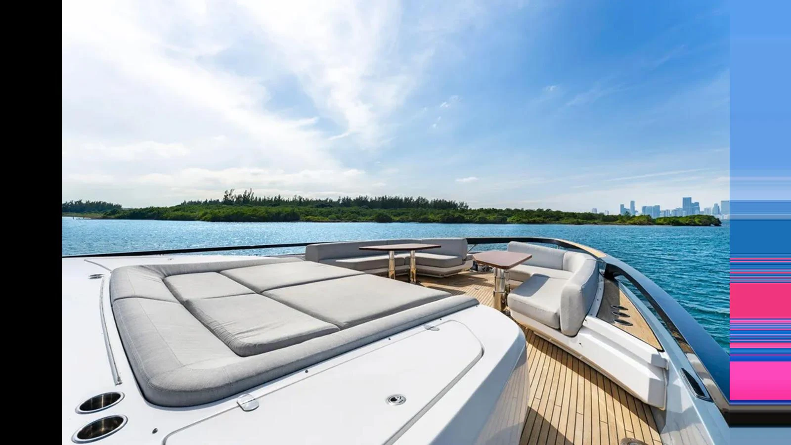 The yacht's foredeck features a spacious sunpad and comfortable seating area with stunning water views. aboard 2022 AZIMUT S10 Yacht for Sale